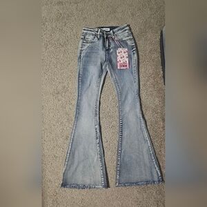 Light Wash Flare Jeans with Raw Hem - Women's Denim